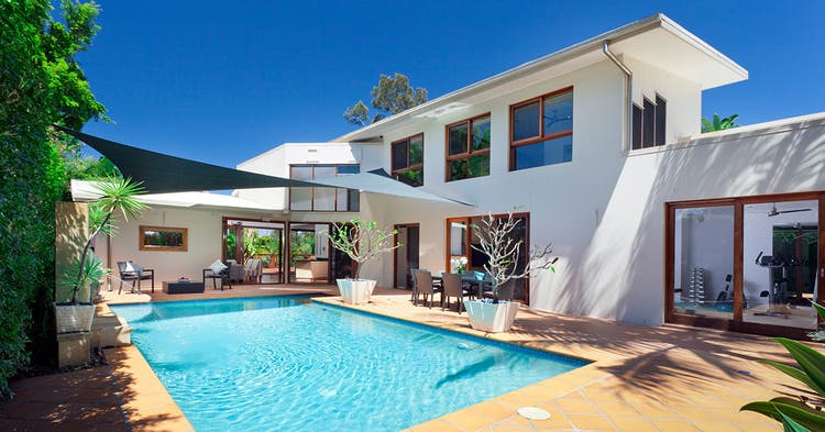 White-2-story house with backyard pool